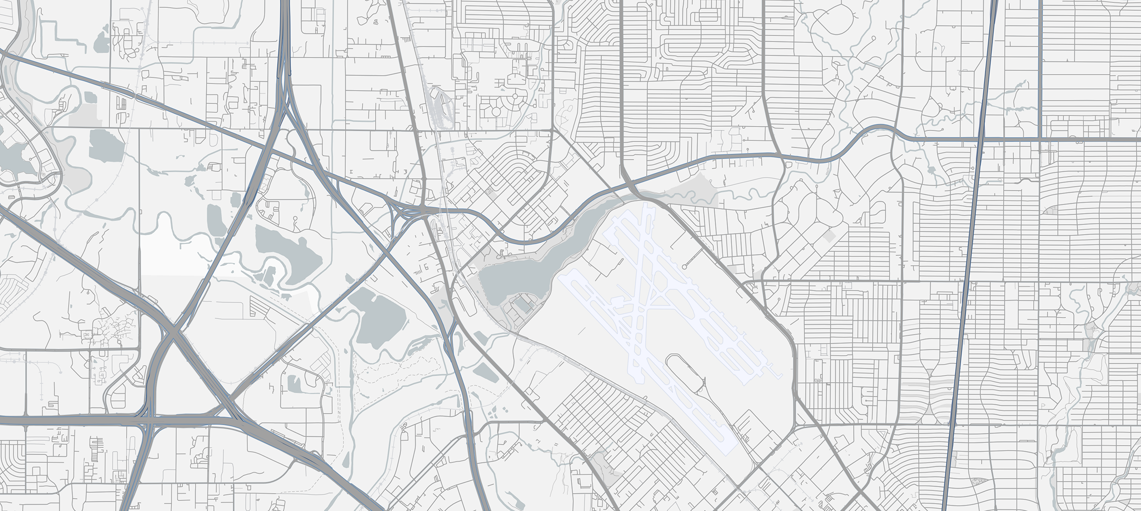 High-resolution map graphic showing city roads, highways, and airport layout