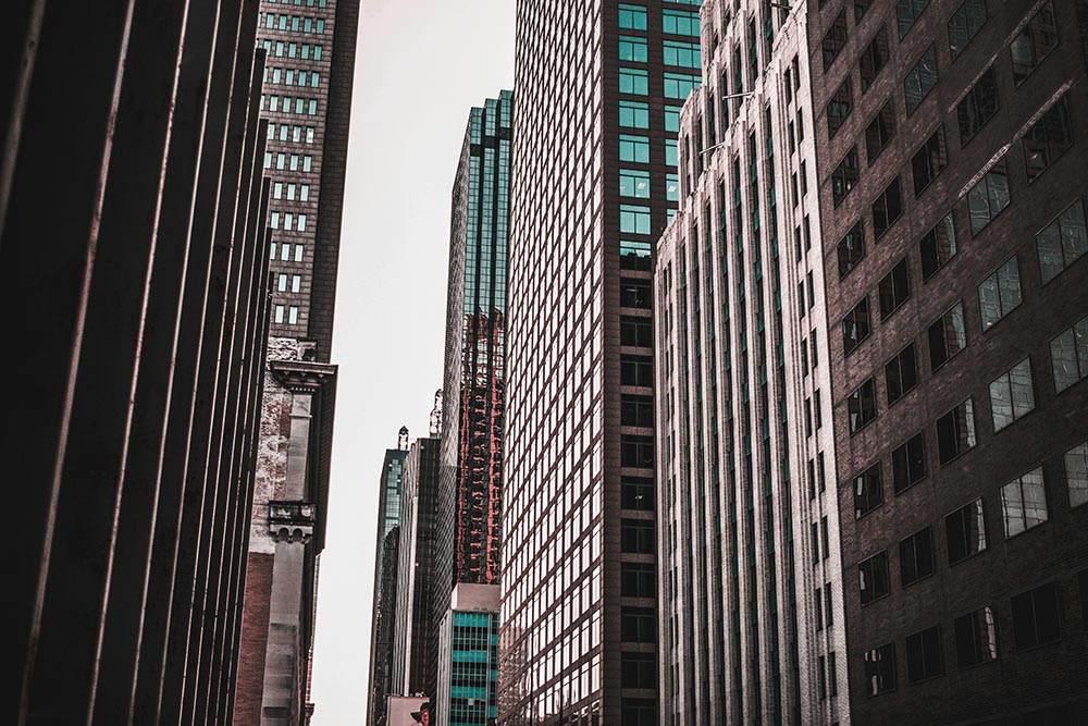 View upward between modern high-rise buildings in an urban city center