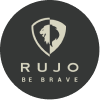 RUJO logo featuring lion head emblem and Be Brave tagline on dark circle background