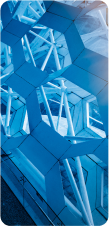 A close-up of a blue, abstract, geometric structure with a repeating honeycomb pattern.