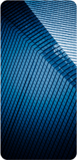 A close-up, abstract view of a modern building's blue and gray patterned facade.